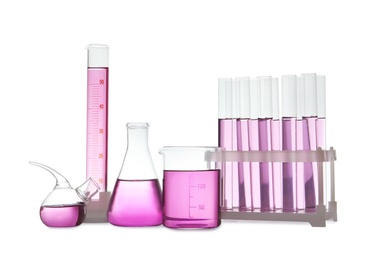 Laboratory glassware with purple liquid on white background