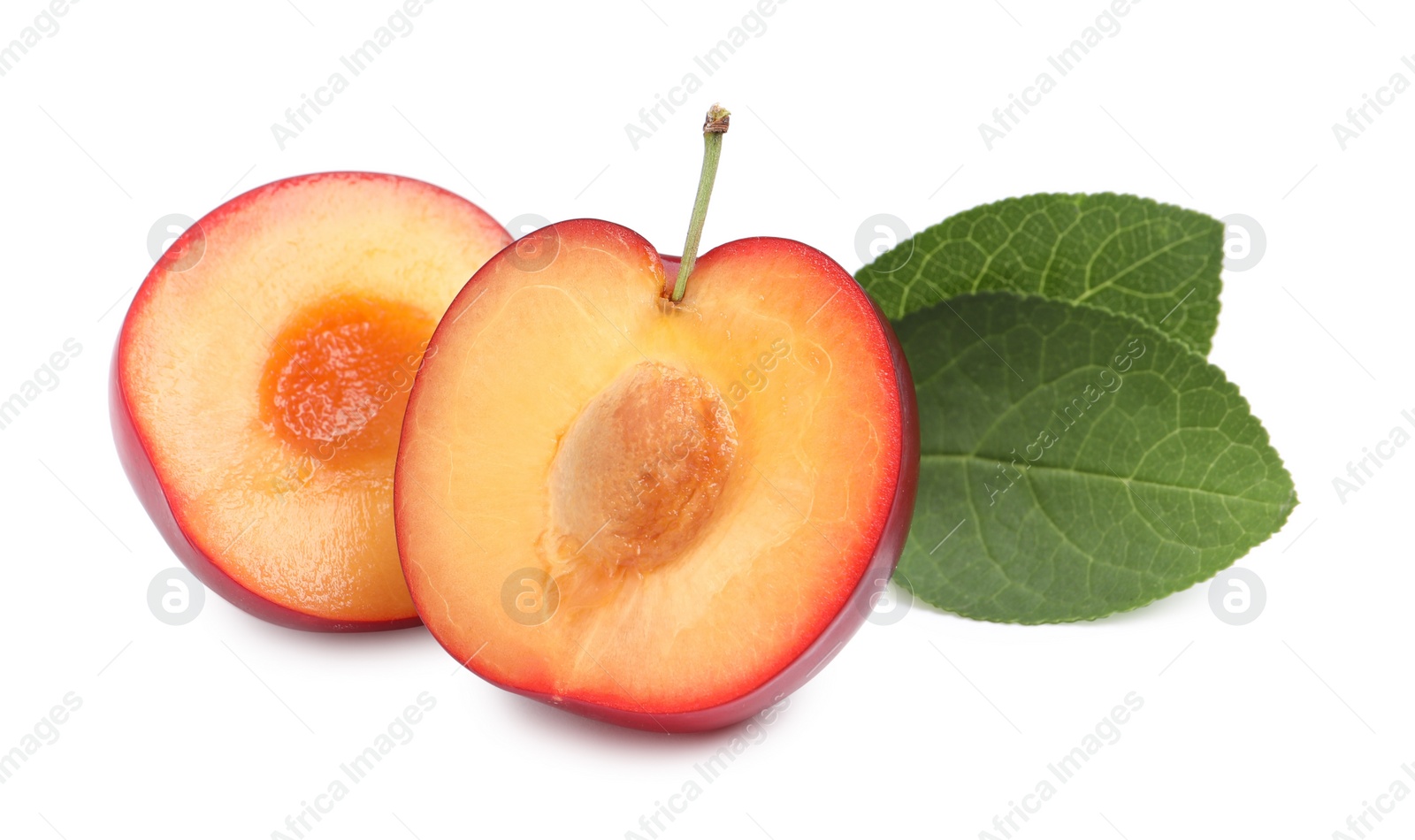 Photo of Cut ripe cherry plum with leaves on white background