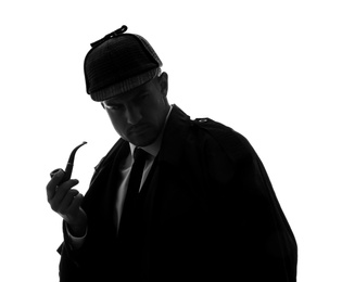 Photo of Old fashioned detective with smoking pipe on white background