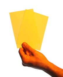 Photo of Man holding yellow flyers on white background, closeup. Mockup for design