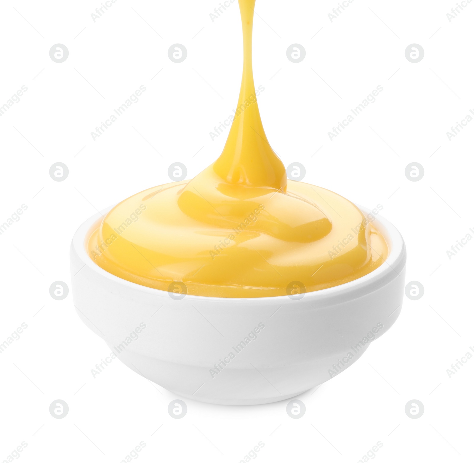 Photo of Delicious cheese sauce in bowl isolated on white