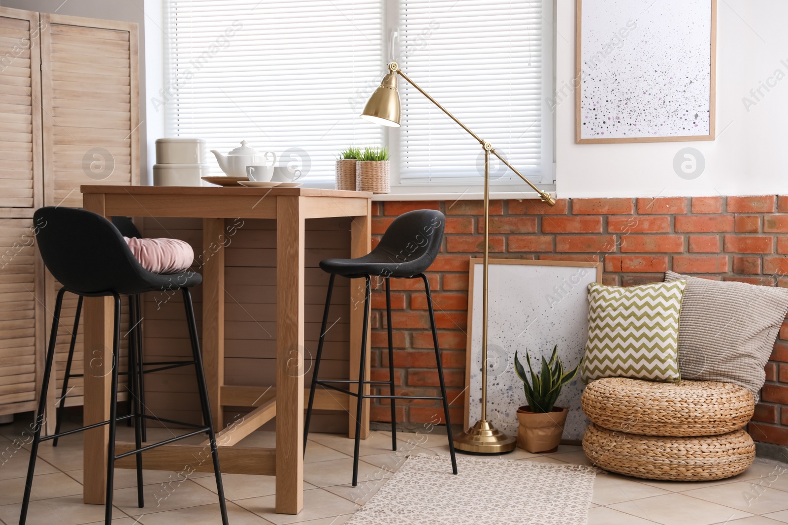 Photo of Stylish room interior with modern furniture and window blinds