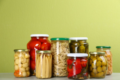 Photo of Jars of pickled vegetables on light table