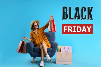 Image of Black Friday Sale. Beautiful young woman with shopping bags sitting in armchair on light blue background