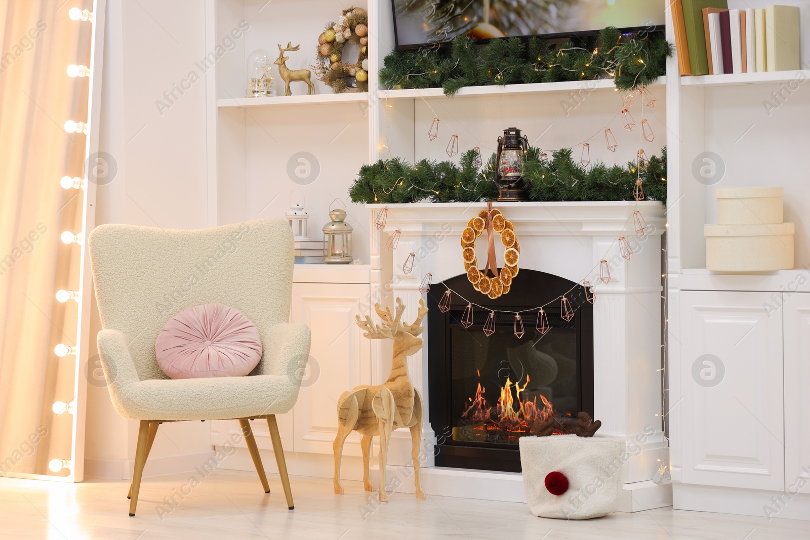 Photo of Living room with fireplace and Christmas decorations. Festive interior design