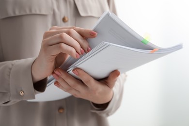 Photo of Woman stacking documents on white background, closeup
