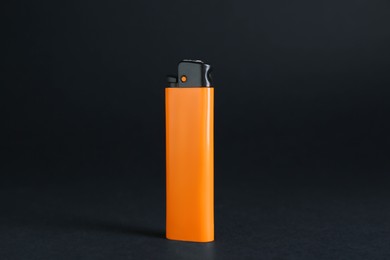 Photo of Stylish small pocket lighter on black background