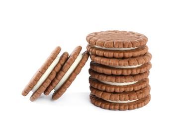 Photo of Tasty chocolate sandwich cookies with cream on white background