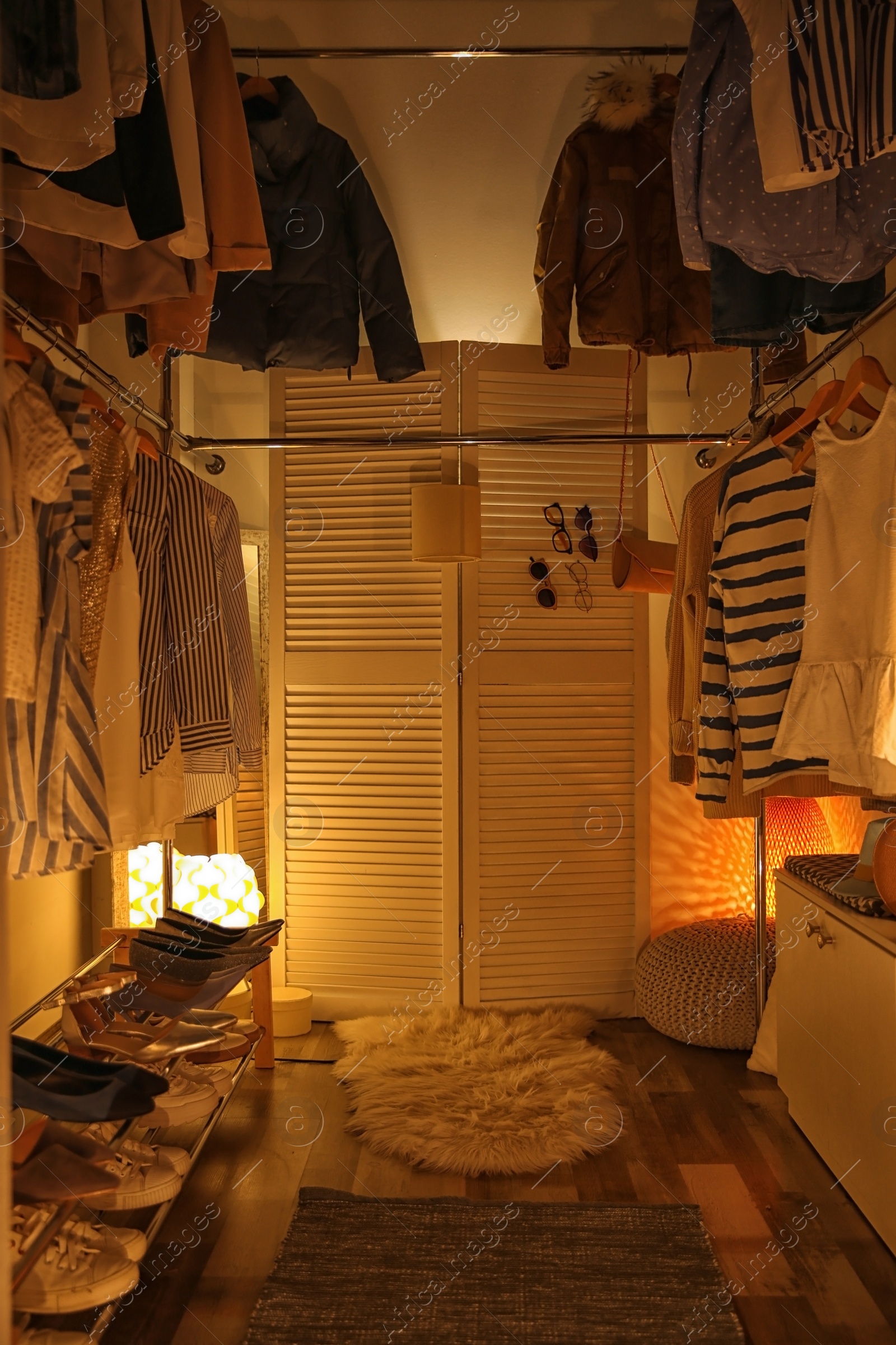 Photo of Modern dressing room with different stylish clothes and accessories