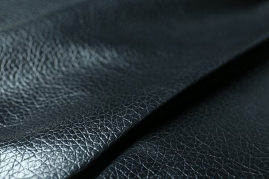 Photo of Black natural leather as background, closeup view