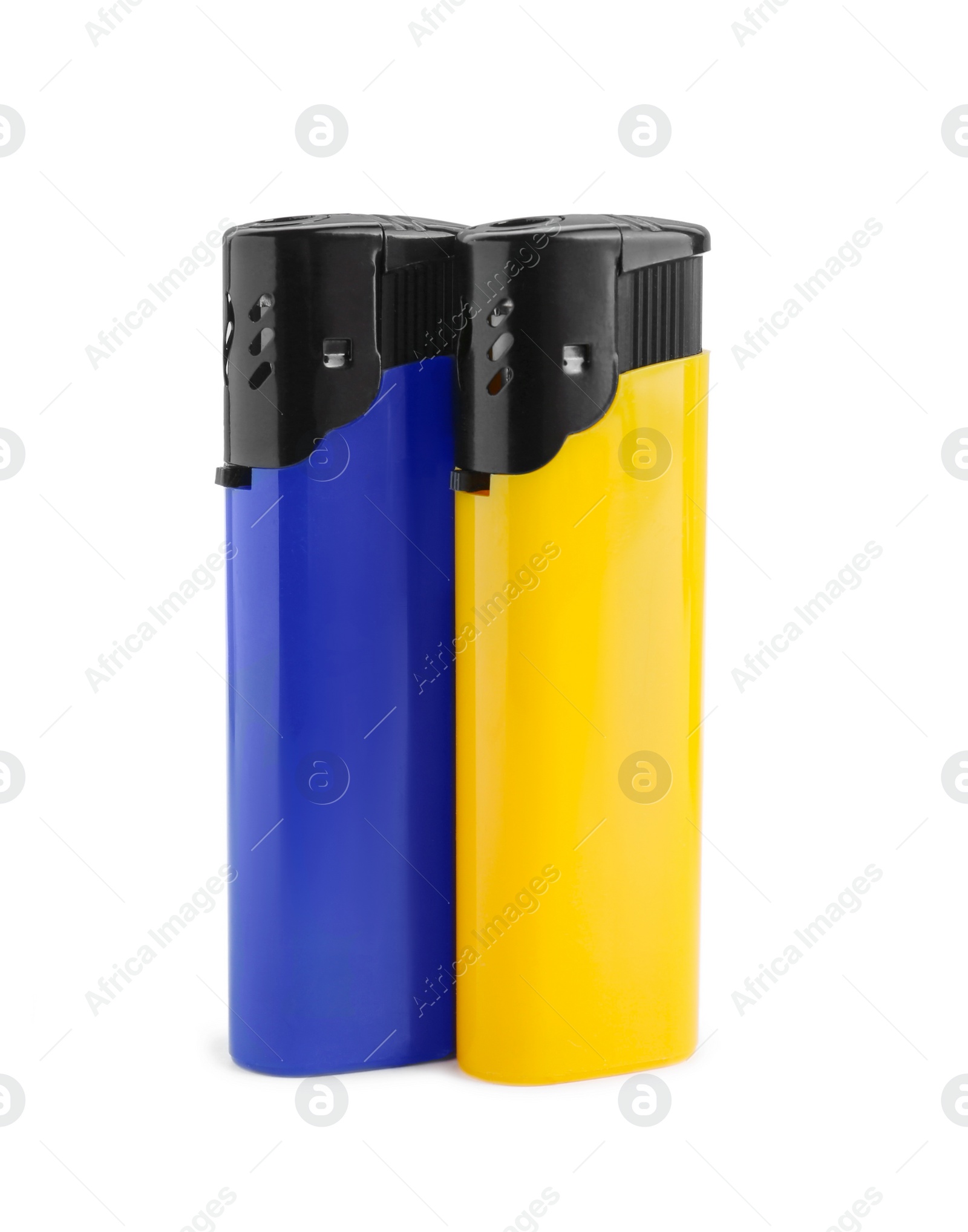 Photo of Stylish small pocket lighters on white background