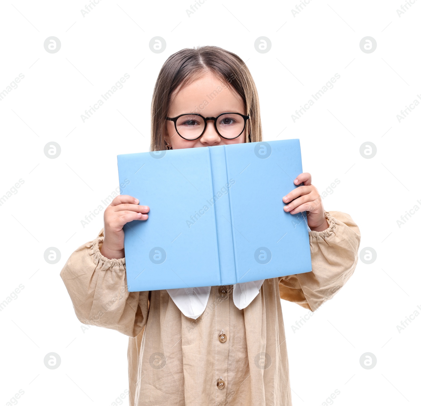 Photo of Cute little girl in glasses with open book on white background