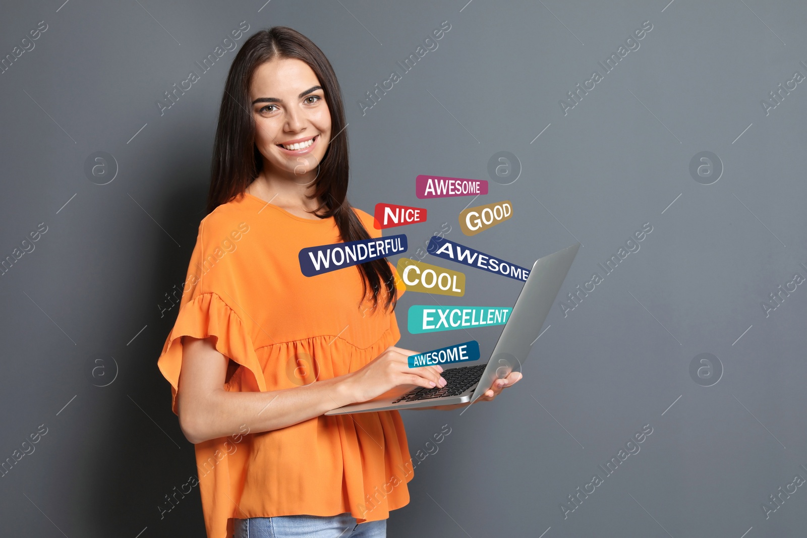 Image of Woman using laptop to give feedback on light grey background. Customer review