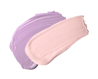 Image of Strokes of pink and purple color correcting concealers on white background, top view