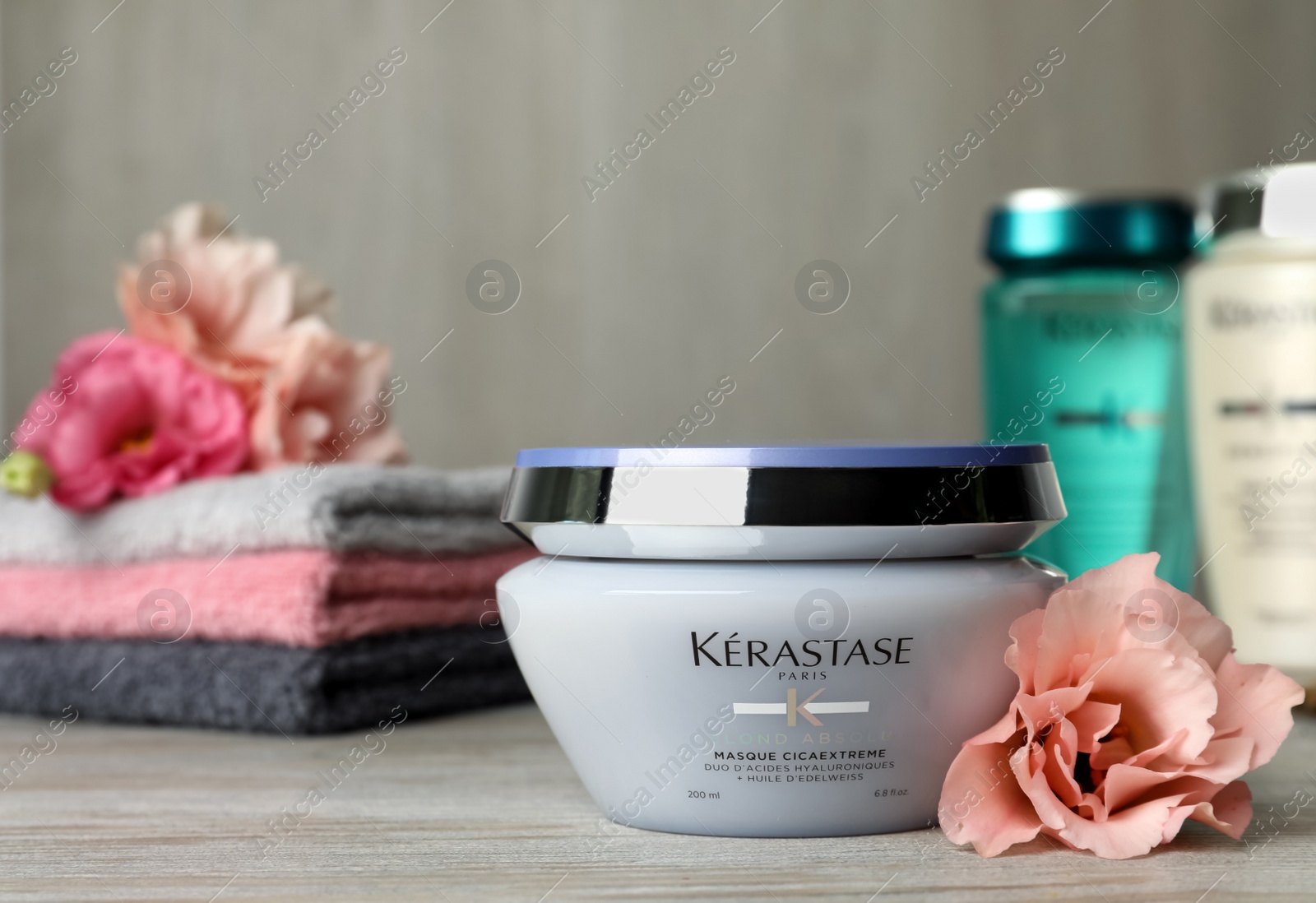 Photo of MYKOLAIV, UKRAINE - SEPTEMBER 07, 2021: Kerastase hair care mask on wooden table