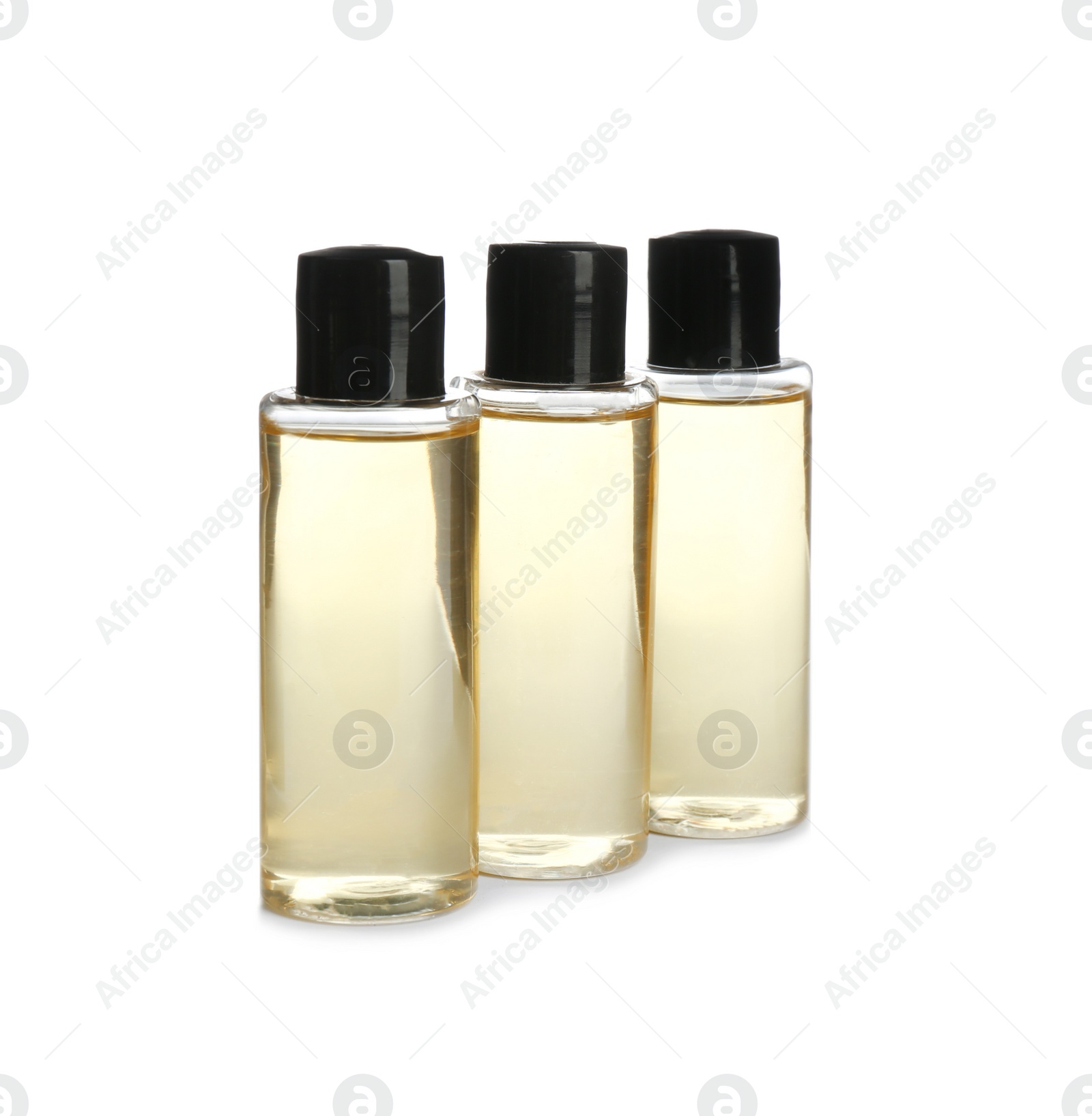 Photo of Mini bottles with cosmetic products on white background. Hotel amenities