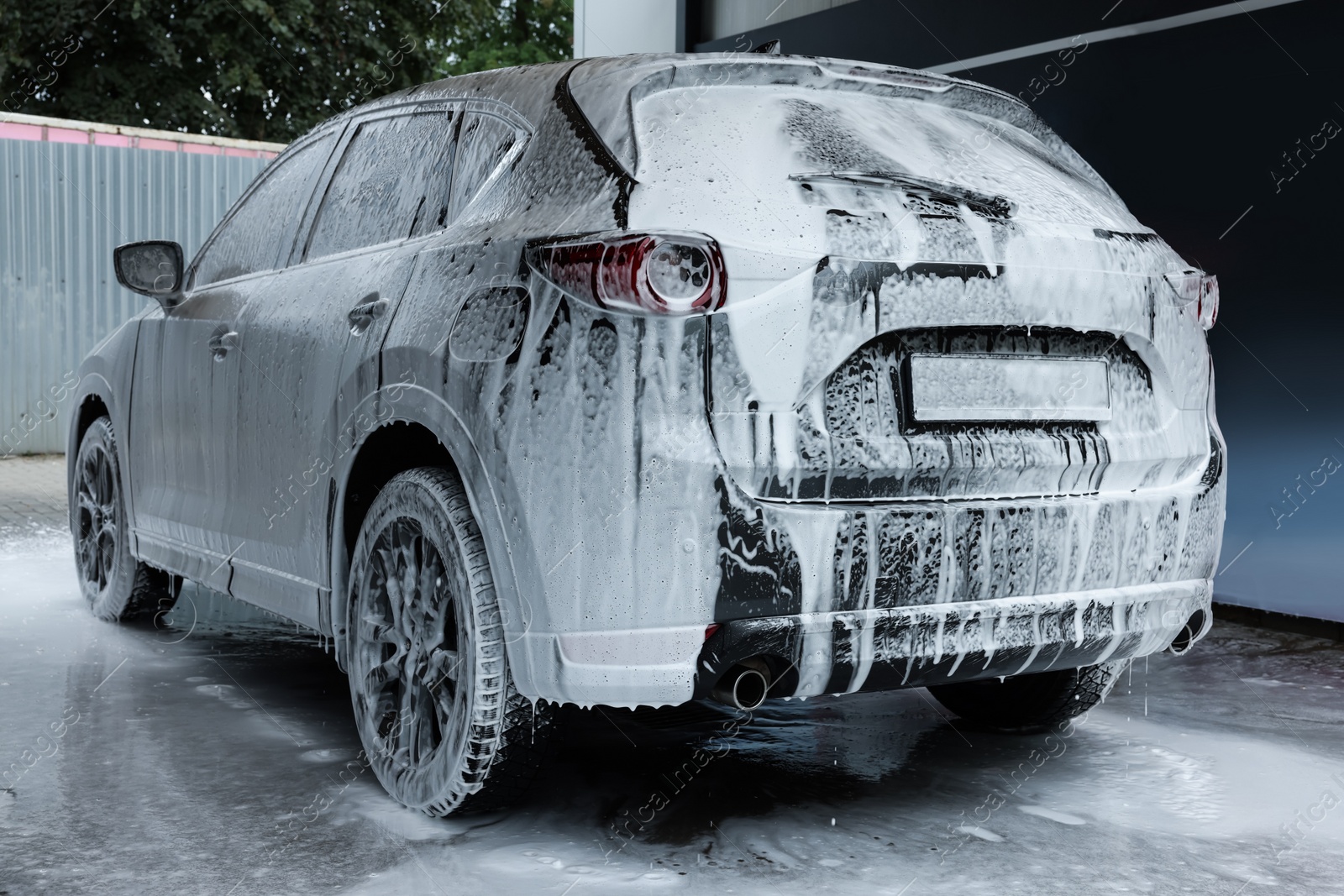 Photo of Auto with cleaning foam at car wash