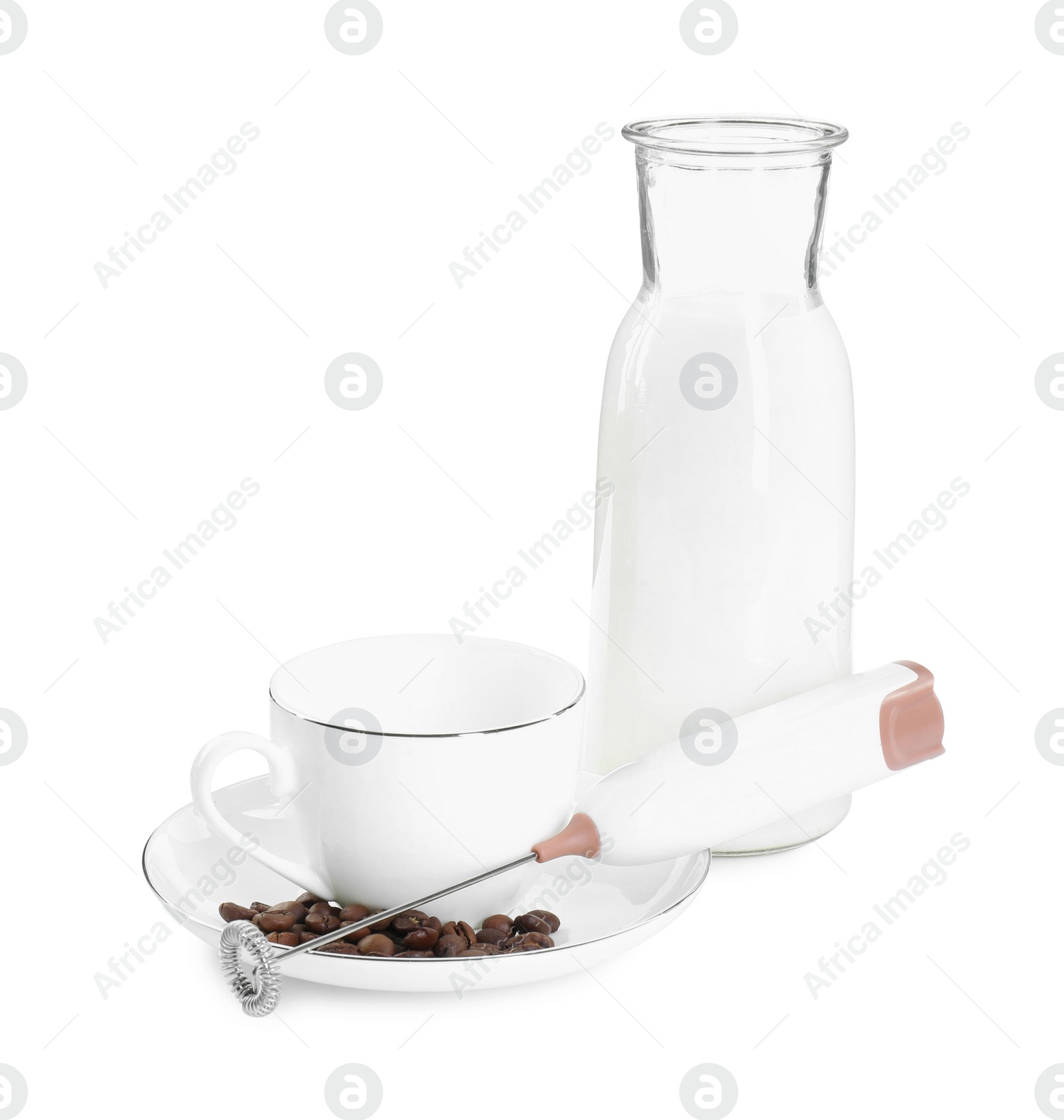 Photo of Mini mixer (milk frother), cup, coffee beans and bottle isolated on white