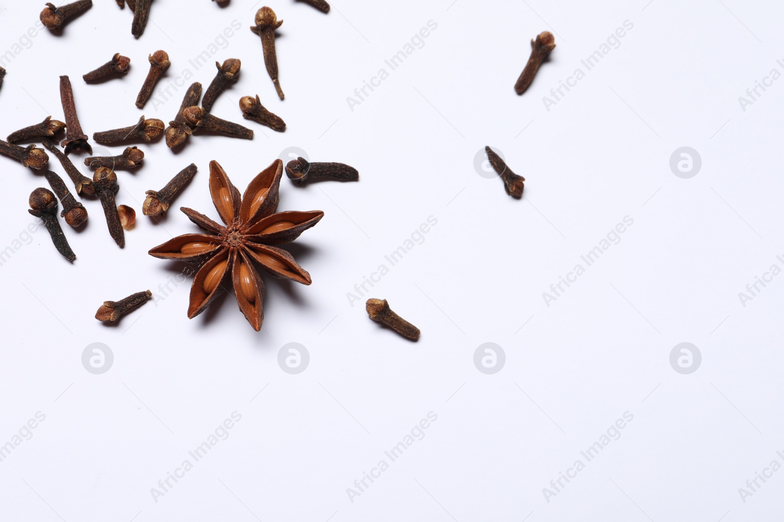 Photo of Different spices on white table, flat lay. Space for text