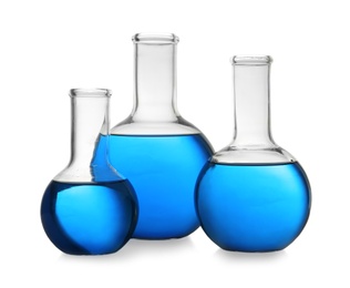 Photo of Florence flasks with blue liquid on white background. Laboratory glassware