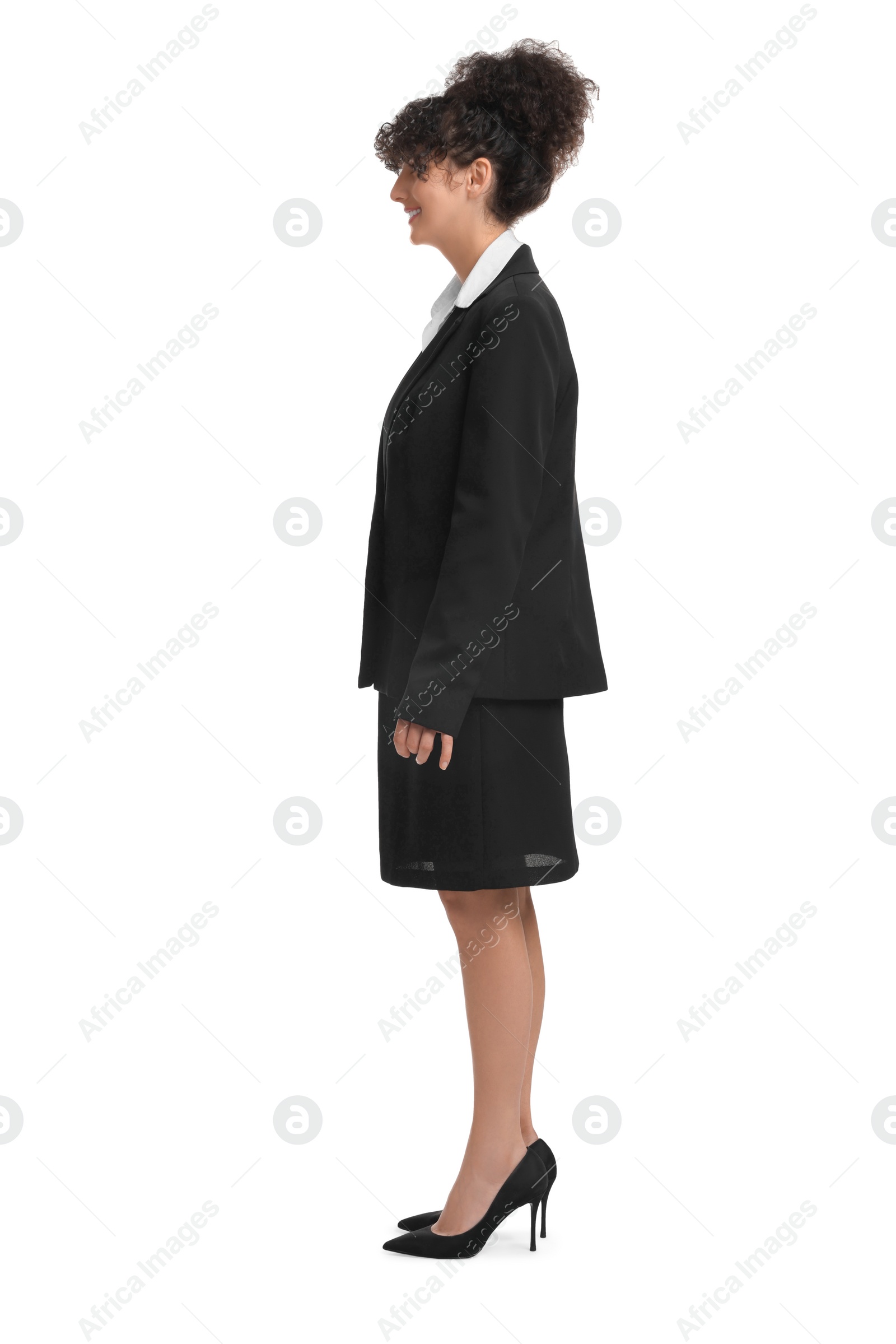 Photo of Young businesswoman in suit standing on white background