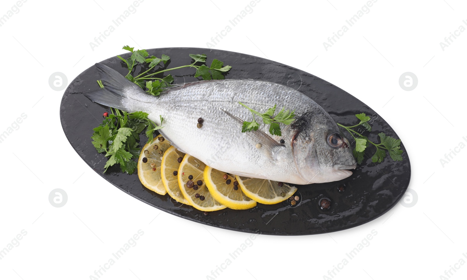 Photo of Raw dorado fish, parsley, lemon slices and peppercorns isolated on white, top view