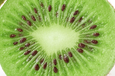 Photo of Fresh cut ripe kiwi as background, top view