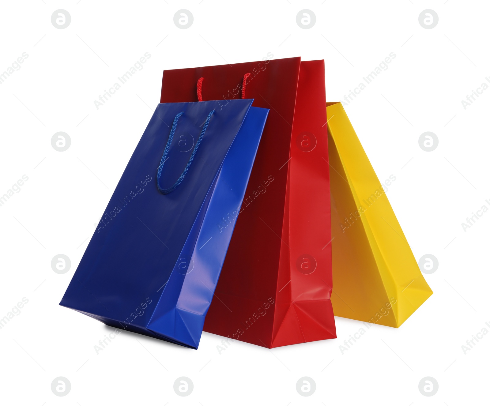 Photo of Colorful paper shopping bags isolated on white