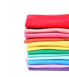 Photo of Stack of colorful t-shirts on white background