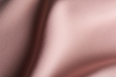 Photo of Texture of beautiful pink fabric as background, closeup