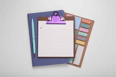 Photo of To do notes, planner and stationery on white background, top view