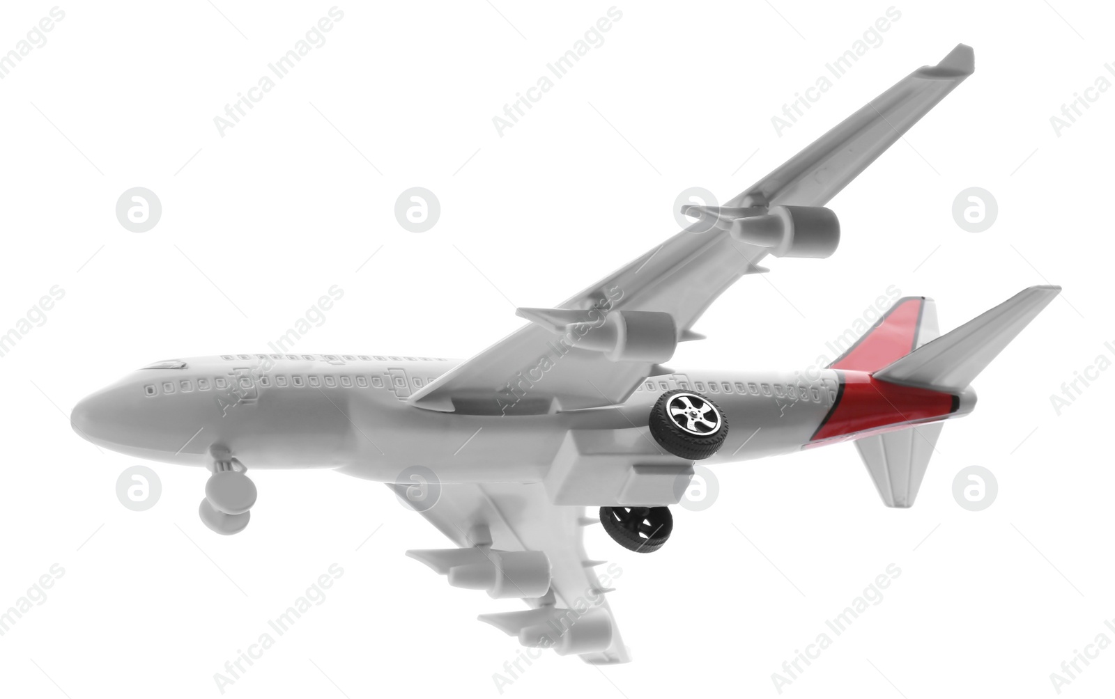 Photo of Toy airplane isolated on white. Travel concept