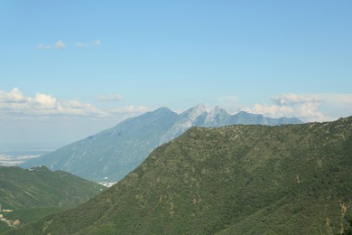 Picturesque view of big mountains under blue sky on sunny day