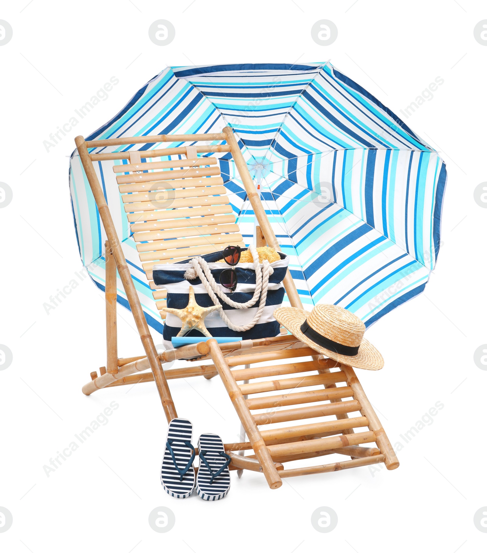 Photo of Deck chair, umbrella and other beach accessories isolated on white