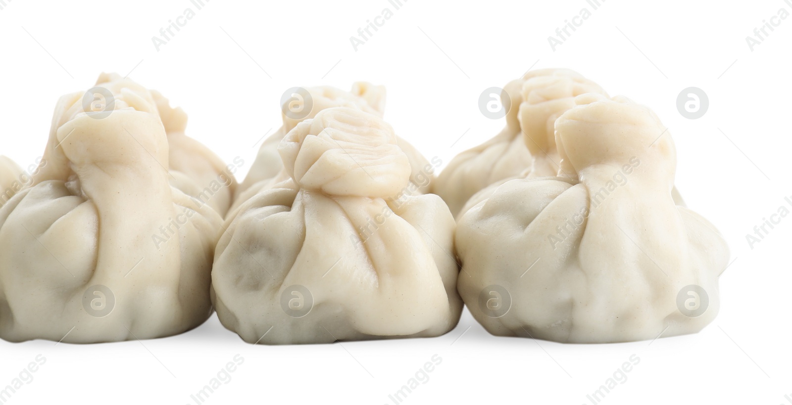 Photo of Many tasty khinkali (dumplings) isolated on white. Georgian cuisine