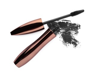 Photo of Applicator, mascara for eyelashes and black smear on white background, top view