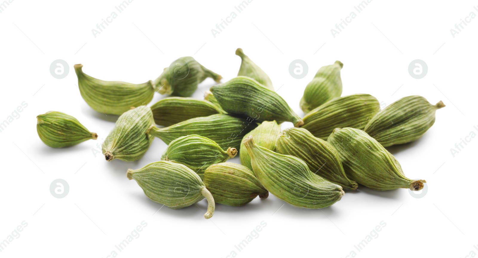 Photo of Pile of dry green cardamom pods on white background