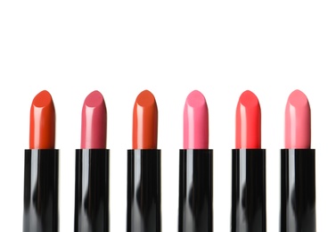 Different lipsticks on white background. Cosmetic product