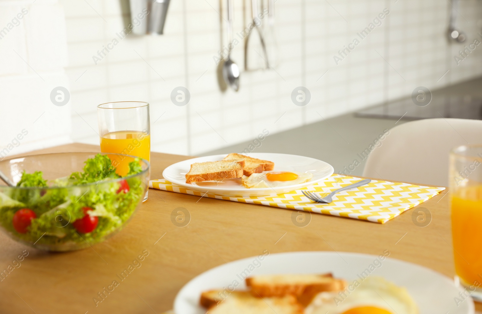 Photo of Tasty breakfast served on table in kitchen