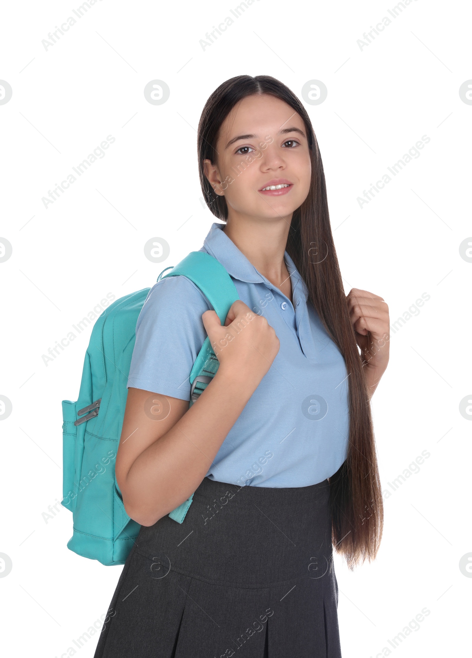 Photo of Teenage girl in school uniform with backpack on white background
