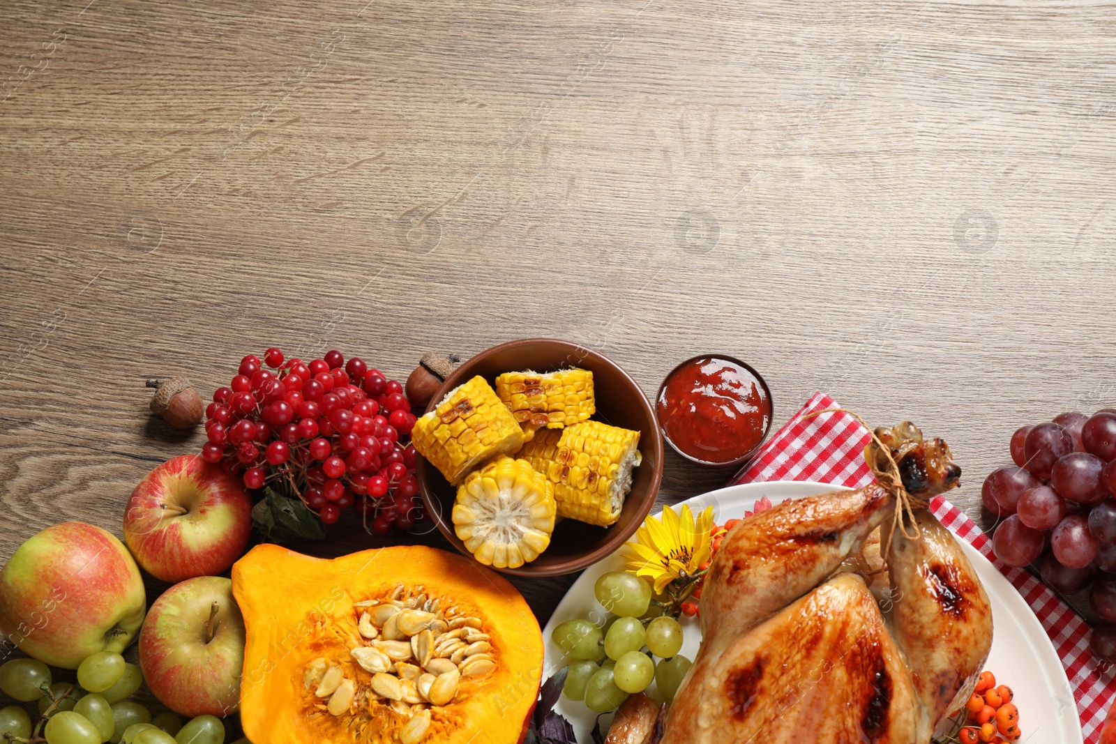 Photo of Flat lay composition with turkey on wooden background, space for text. Happy Thanksgiving day