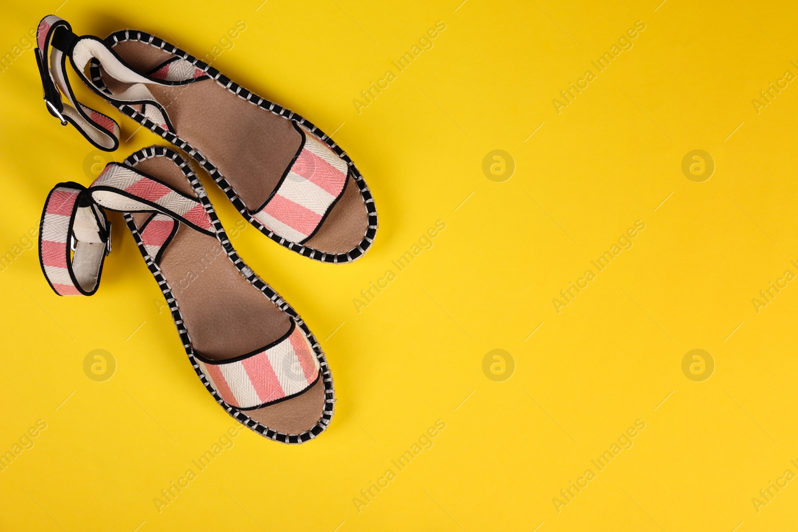 Photo of Pair of female shoes on color background, top view