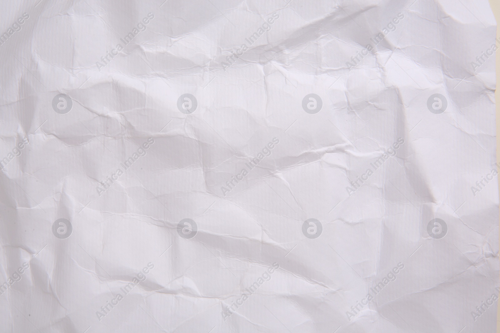 Photo of Texture of crumpled parchment paper as background, top view