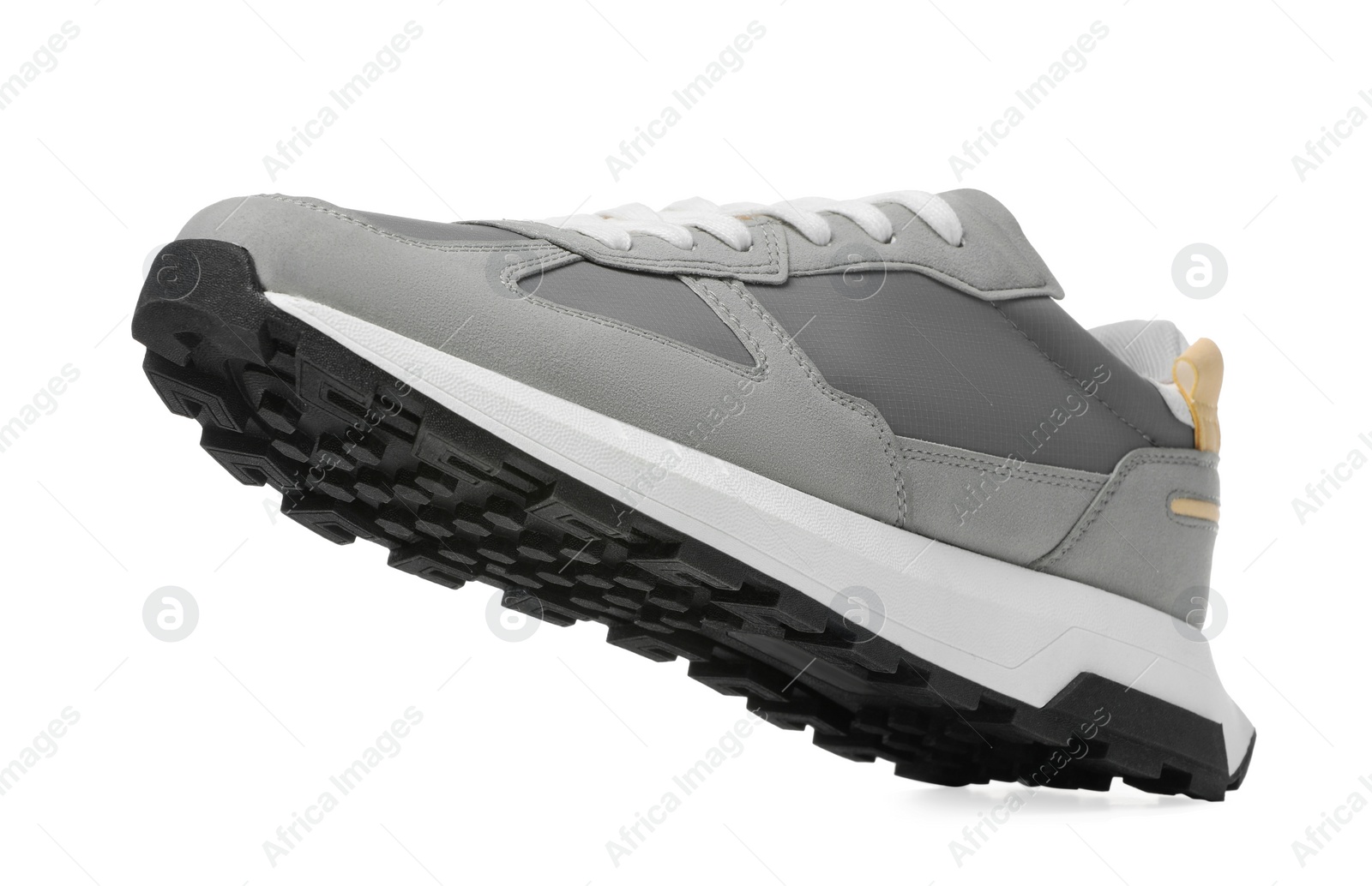 Photo of One stylish grey sneaker isolated on white