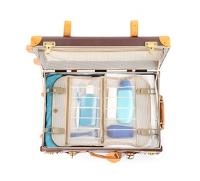 Photo of Packed suitcase with deodorant and body hygiene kit on white background, top view