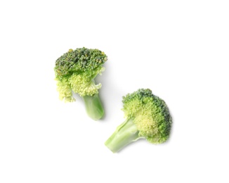 Photo of Fresh green broccoli on light background, top view