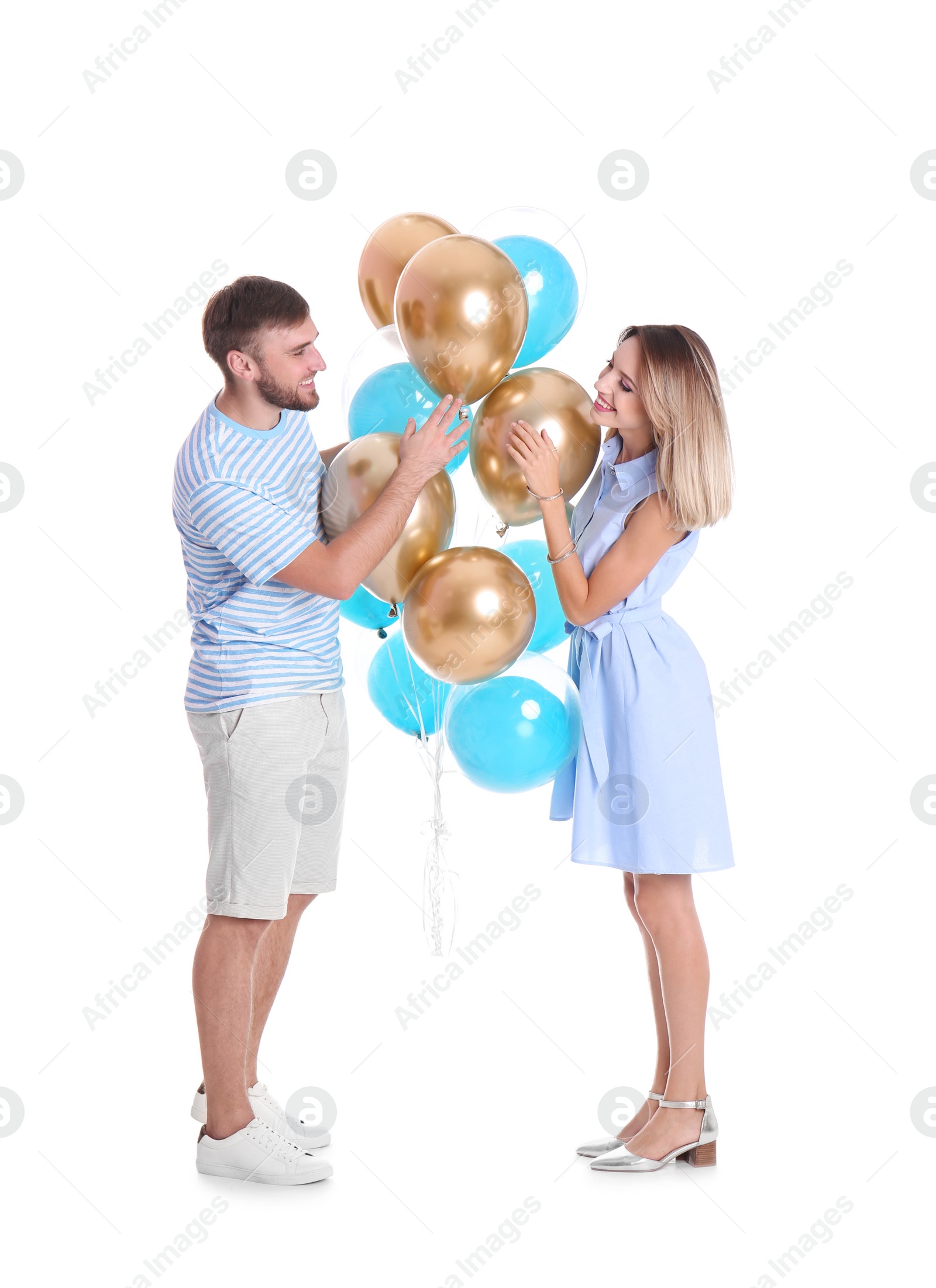 Photo of Young couple with air balloons on white background