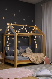 Stylish child room interior with comfortable bed