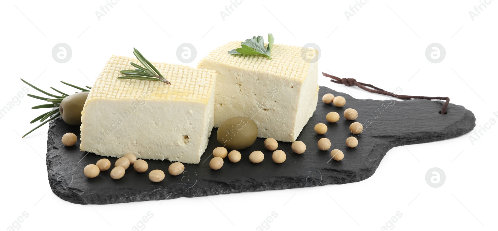 Photo of Pieces of delicious tofu with herbs, olives and soy on white background