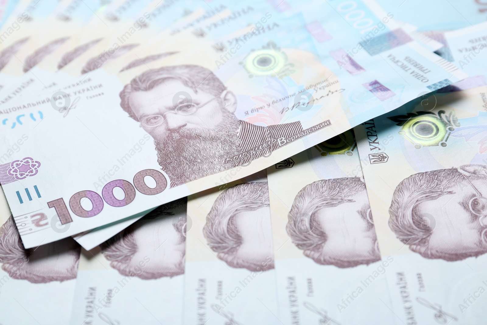 Photo of Closeup view of Ukrainian money as background. National currency